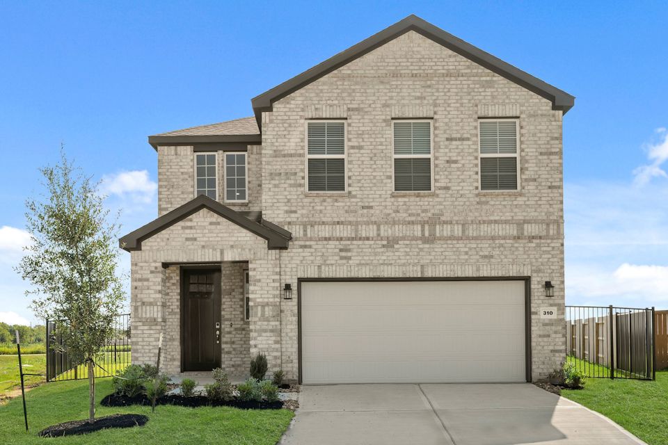 A grey house with a garage.