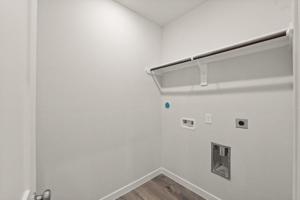 A white wall with a light on it.