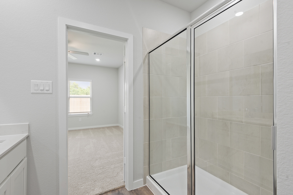 A bathroom with a glass shower.