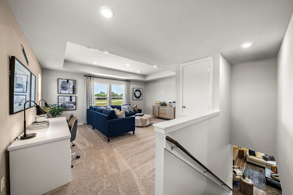 A living room with a couch and a table.