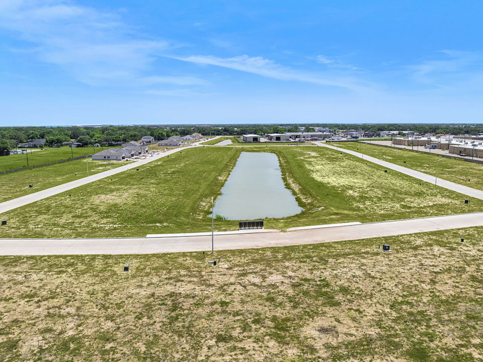 A golf course with a green field.
