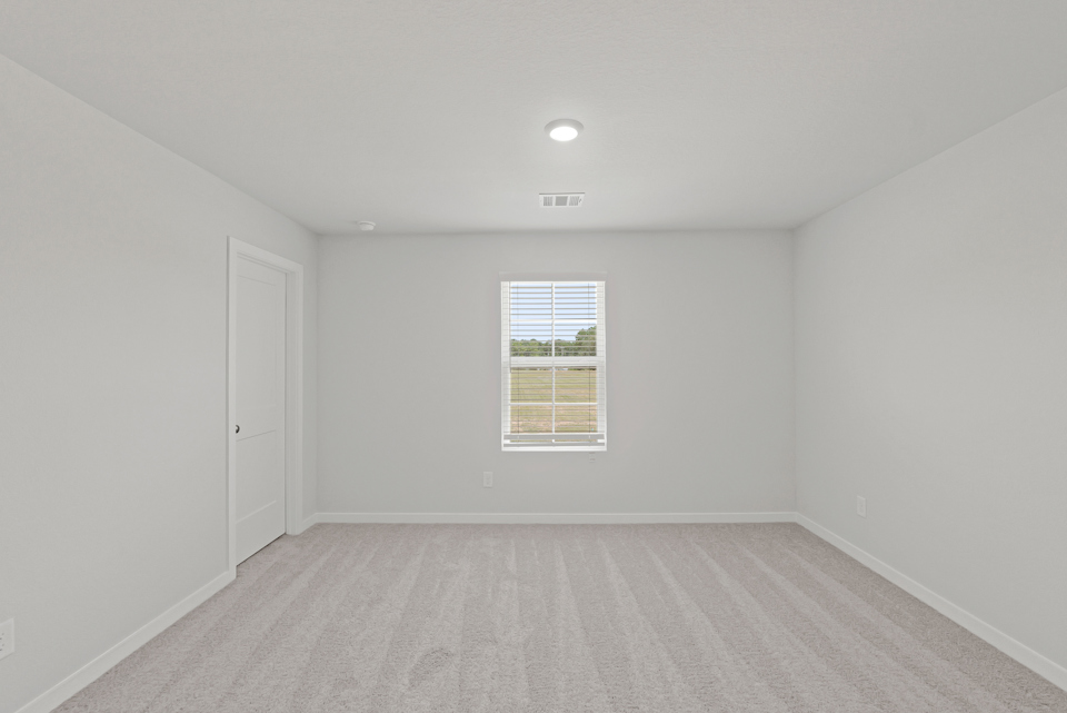 A room with a door and a window.