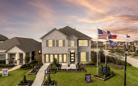 A house with flags in the front.
