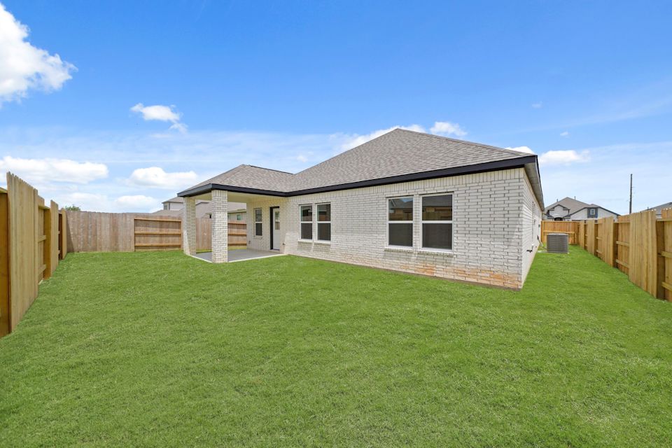 A house with a green lawn.