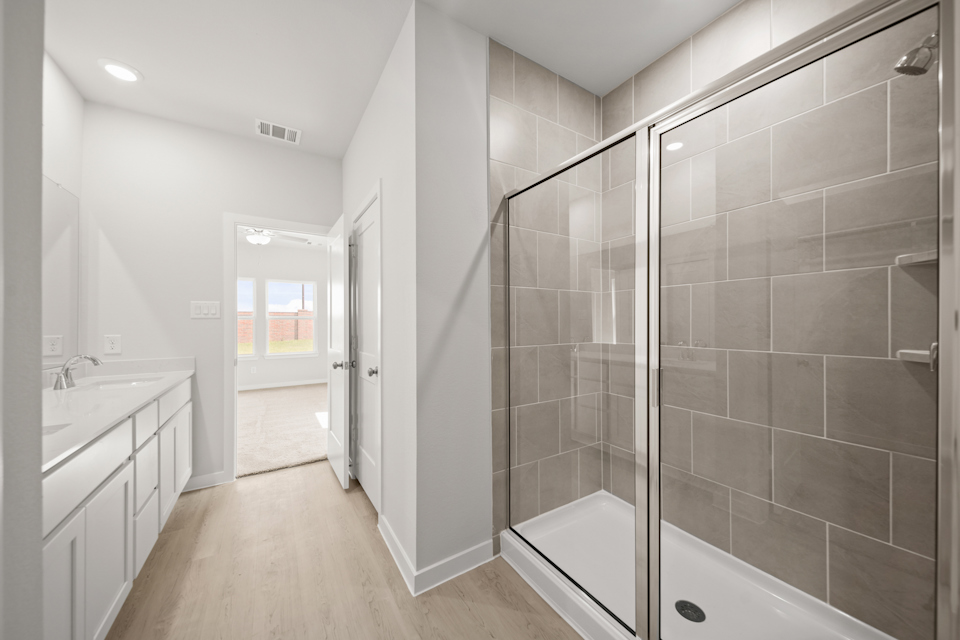 A bathroom with a glass shower.