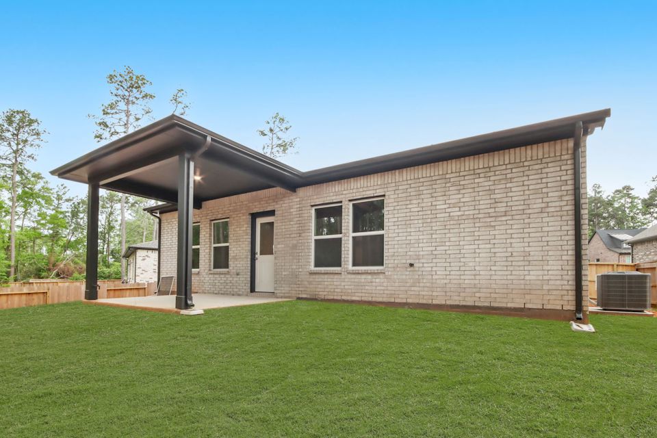 A house with a grass yard.