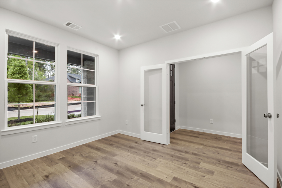 A room with white walls and windows.