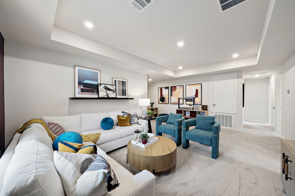 A living room with a couch and a coffee table.