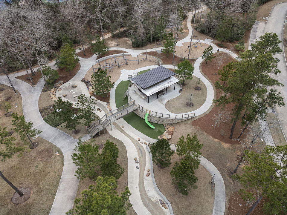 A building with a courtyard and trees around it.