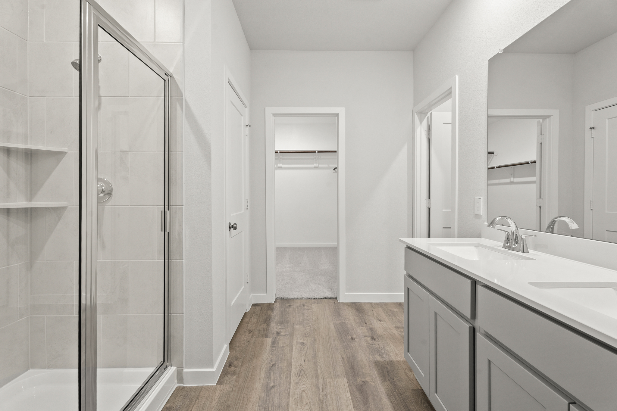 A bathroom with a glass shower.