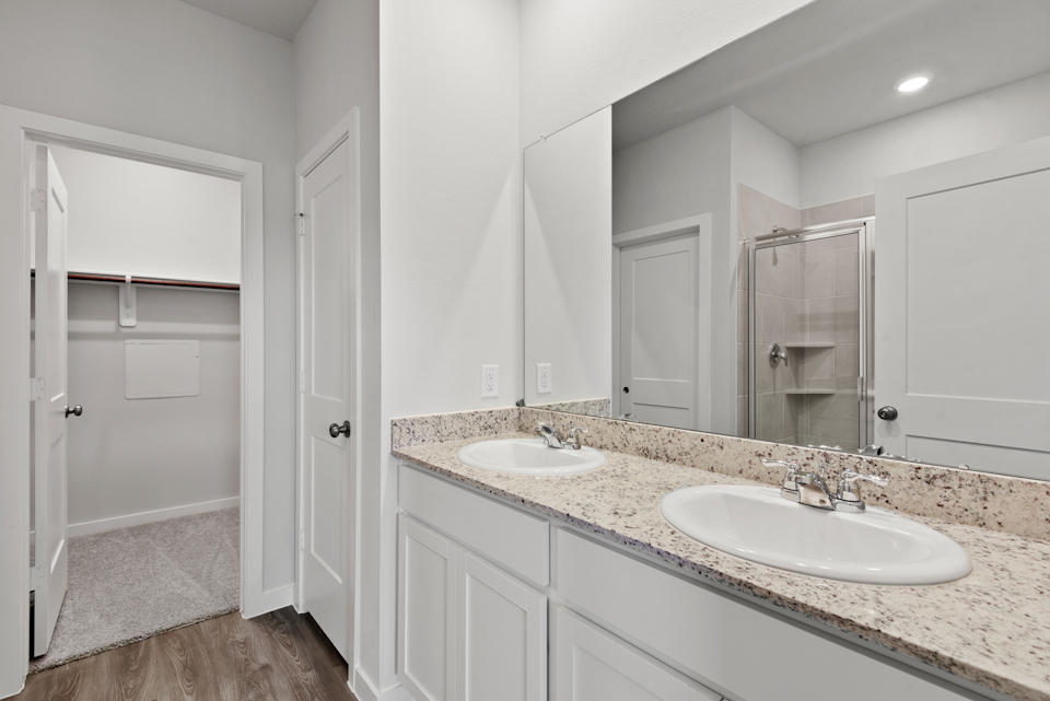 A bathroom with a marble countertop.