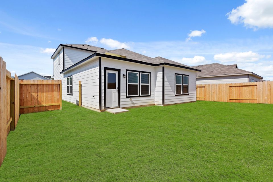 A house with a grass yard.