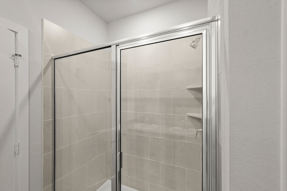 A shower unit in a bathroom.