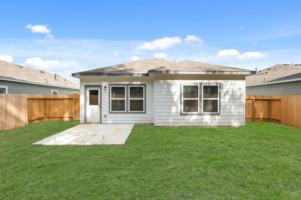 A house with a fence around it.
