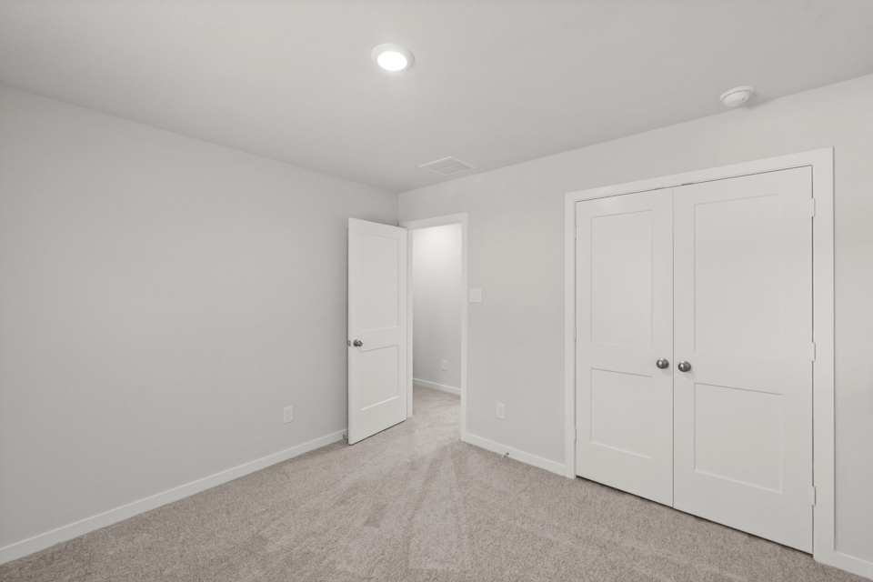 A room with white doors.