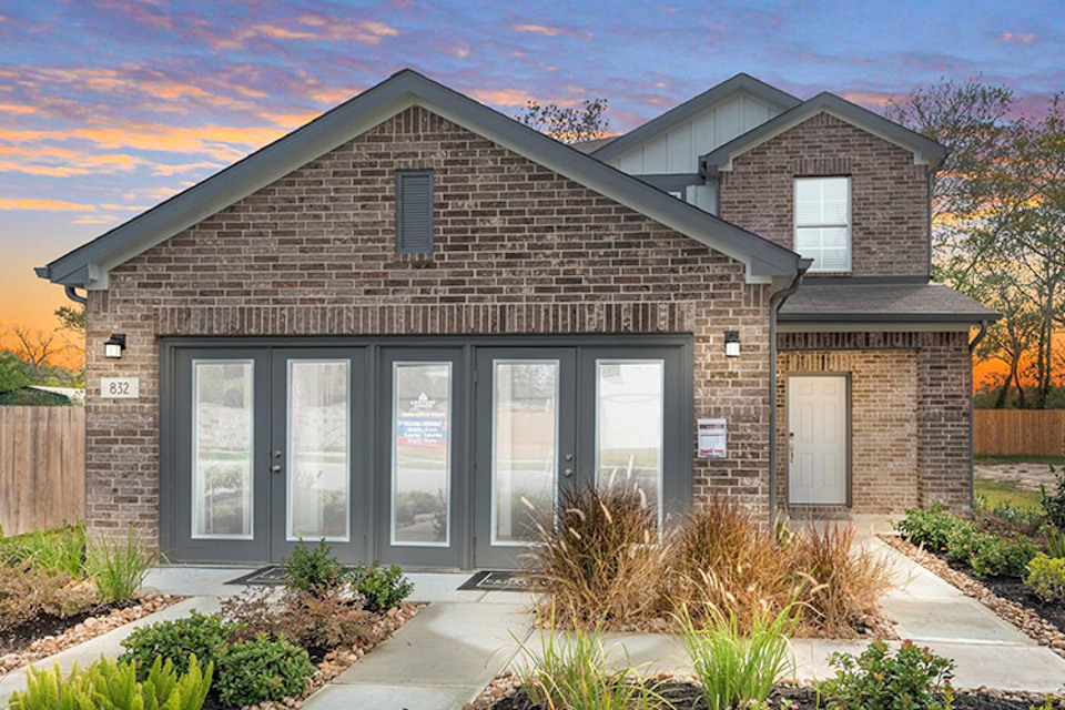 A brick building with a driveway.
