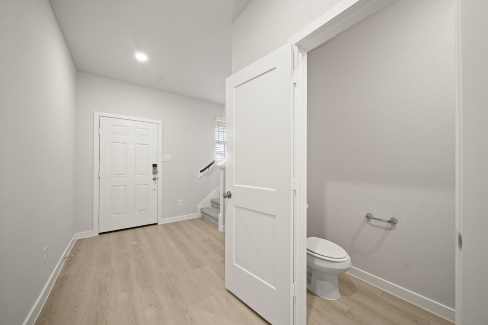 A bathroom with white doors.