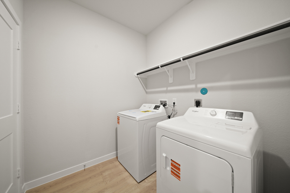 A laundry room with a washer and dryer.