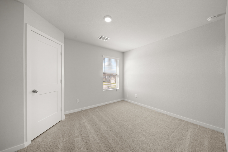 A room with a door and a window.