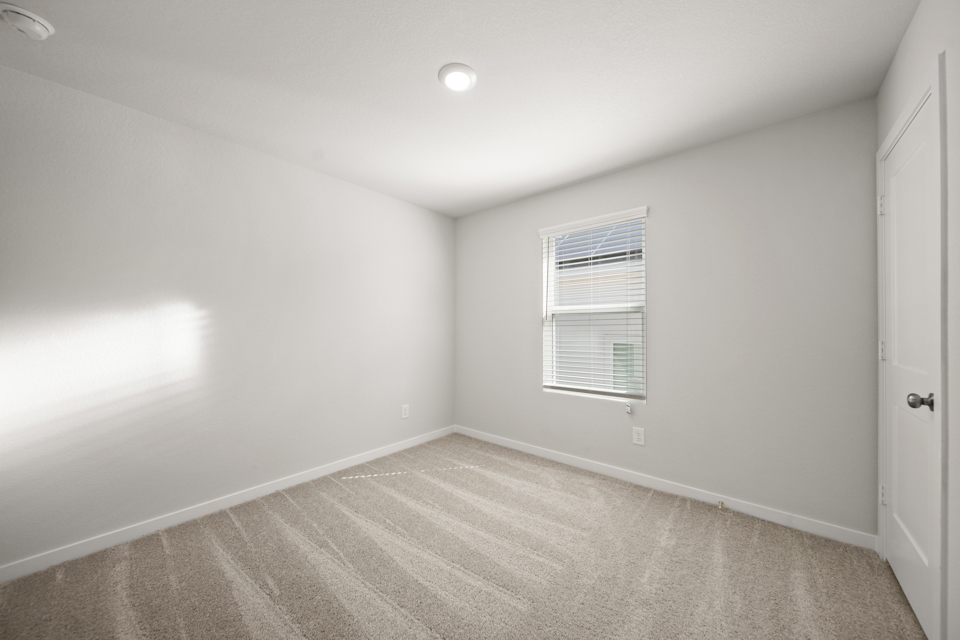 A room with a door and a window.