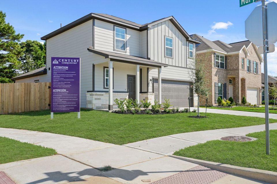 A house with a sign in front.