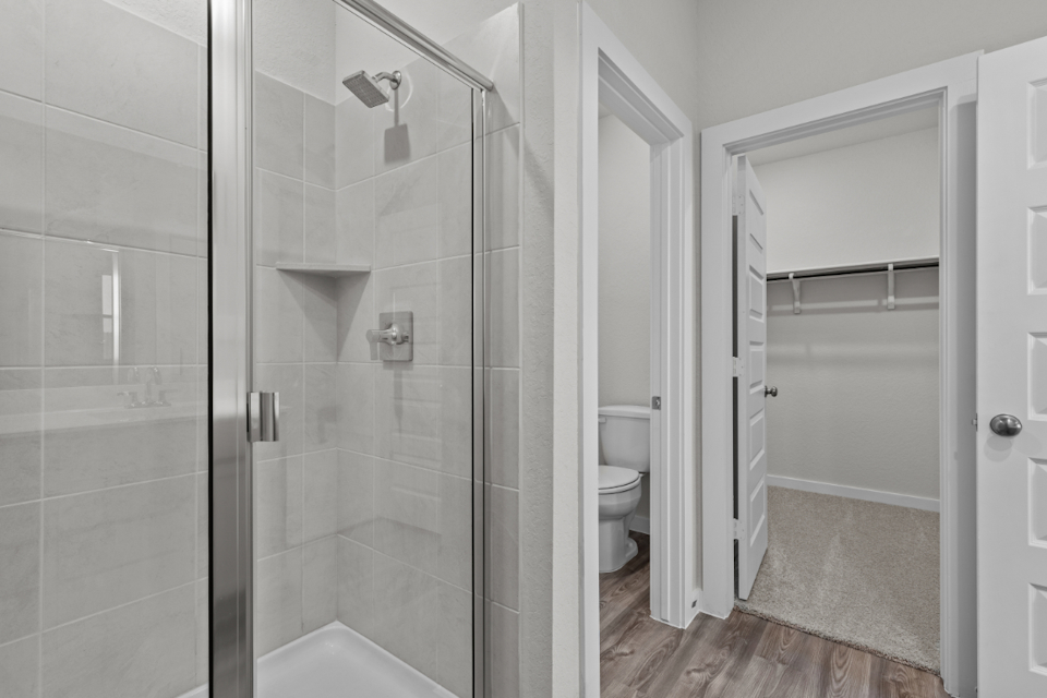 A bathroom with a glass shower.