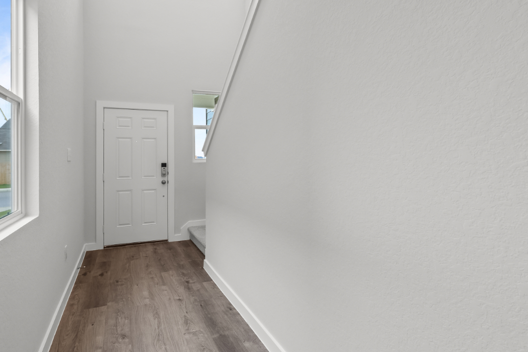 A room with a door and a window.