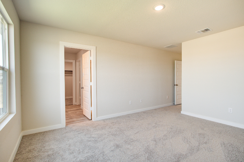 A room with a door and a window.