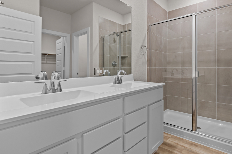 A bathroom with a glass shower.