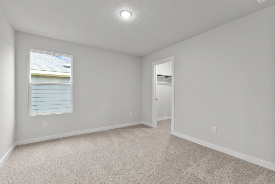 A room with a door and a window.