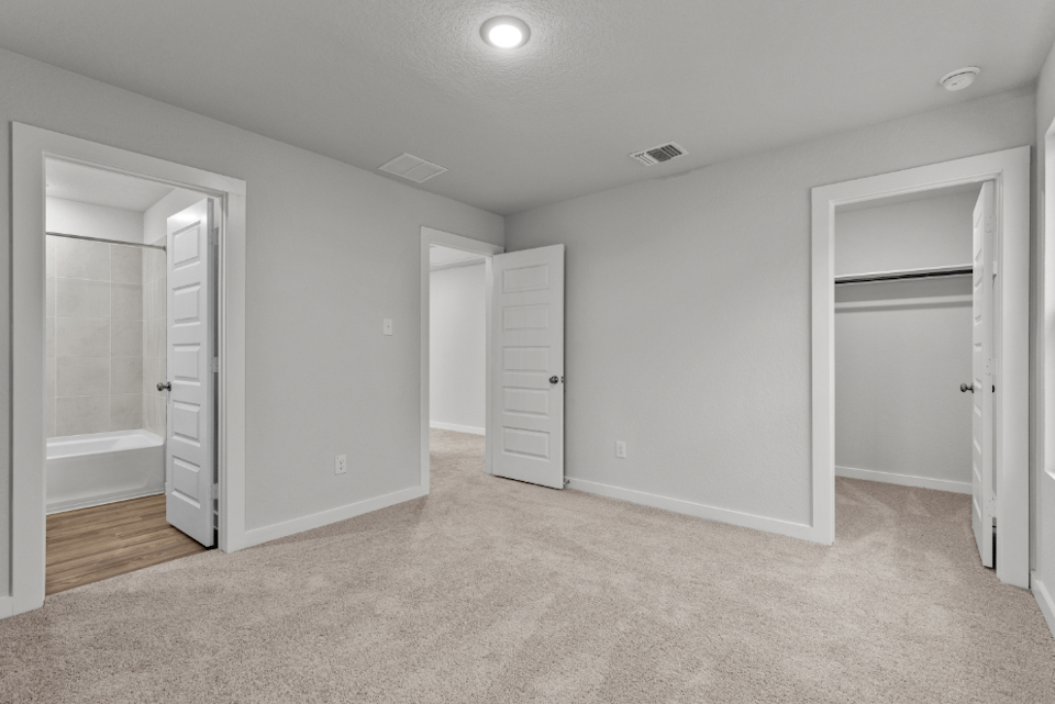 A room with white cabinets.