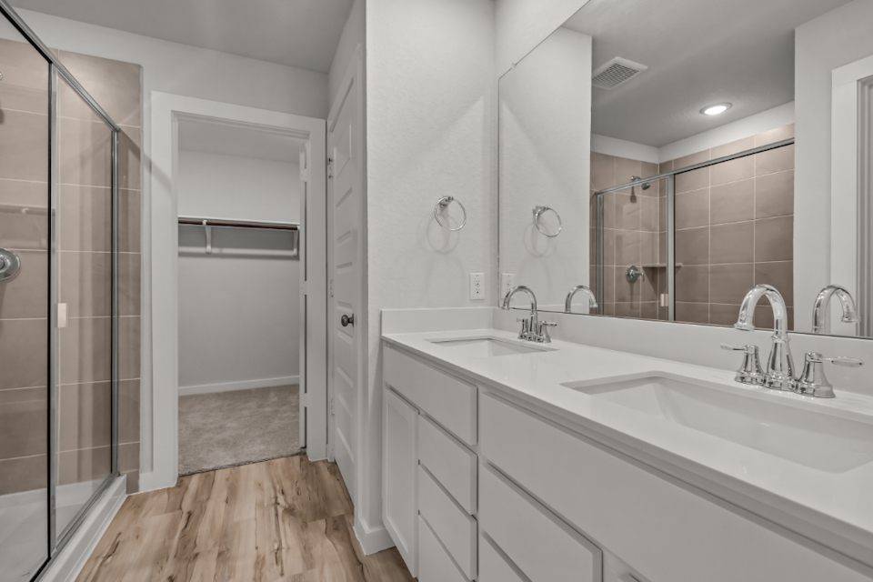 A bathroom with a glass shower.