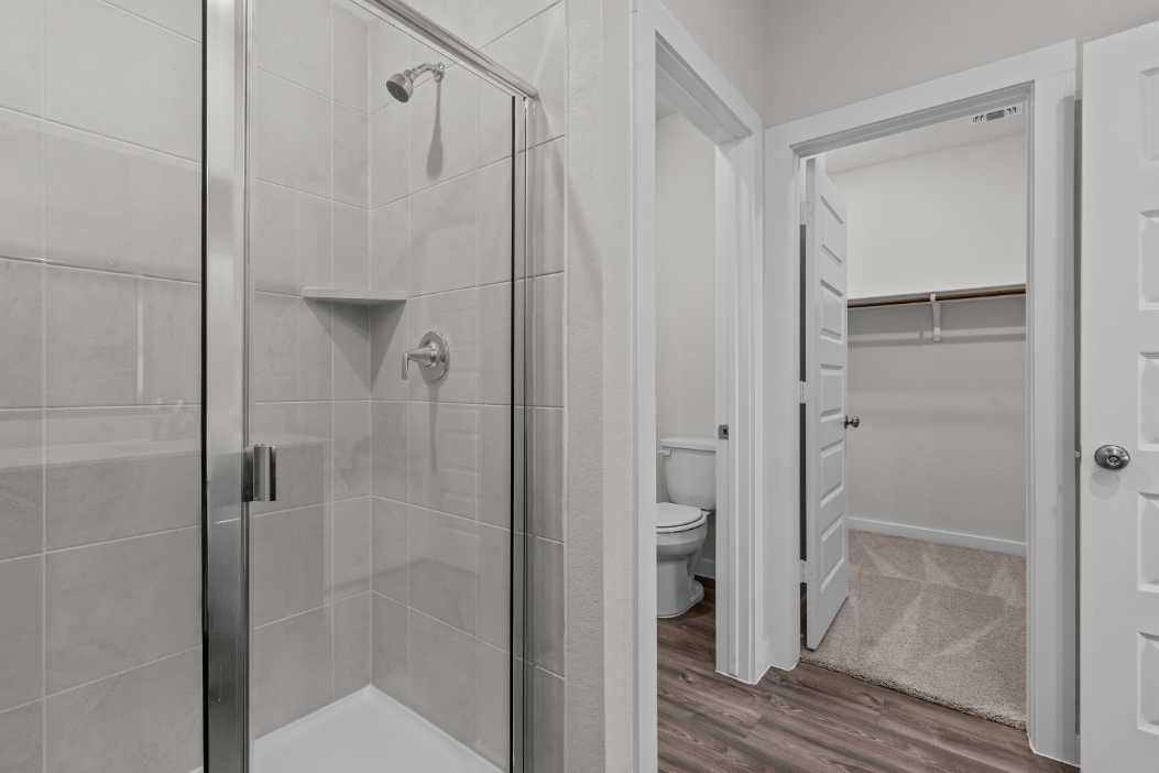 A bathroom with a glass shower.