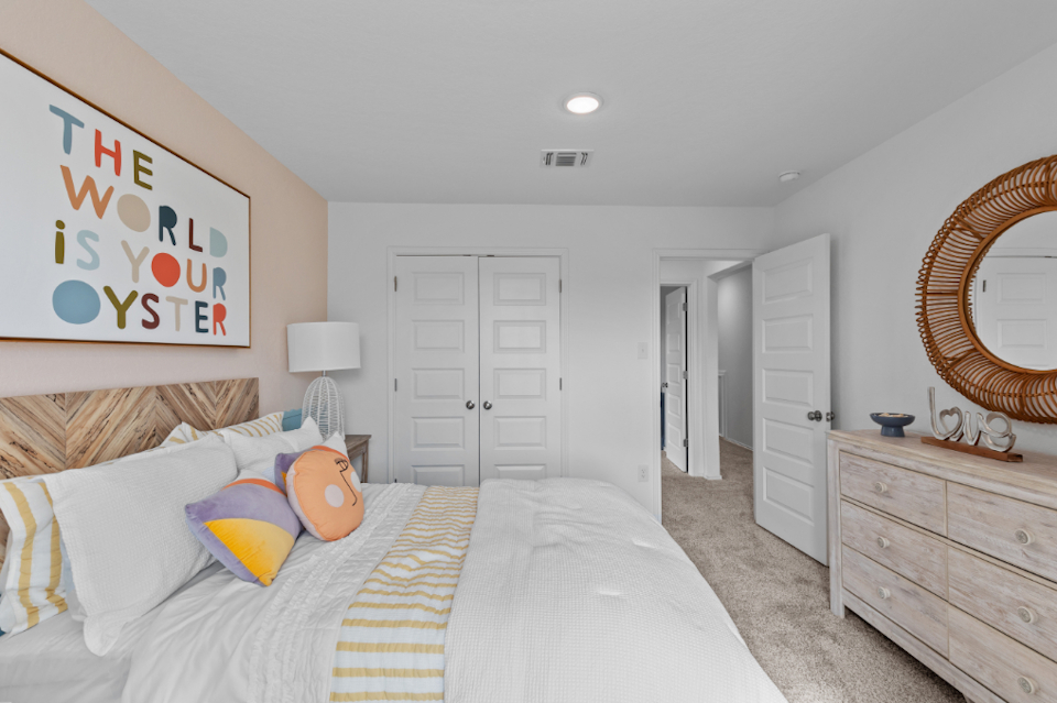 A bedroom with two beds.