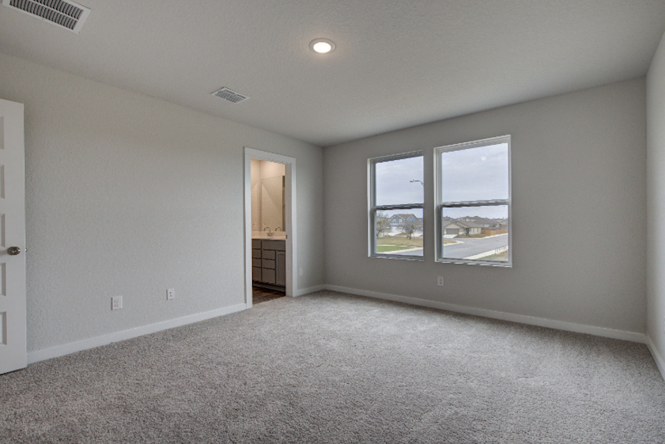 A room with a window and a door.