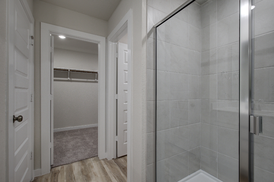 A shower with glass doors.