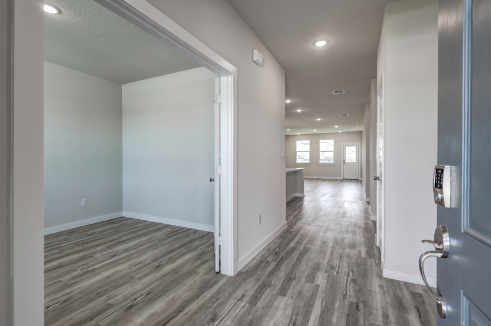 A hallway with white doors.