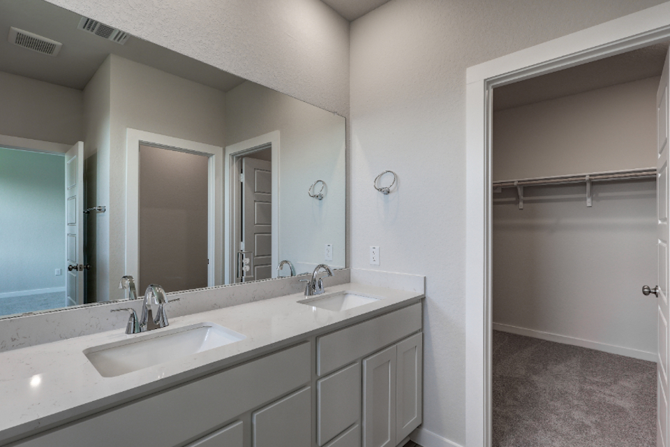 A bathroom with a couple of sinks.
