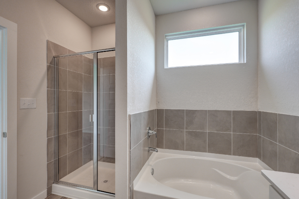 A bathroom with a glass shower.