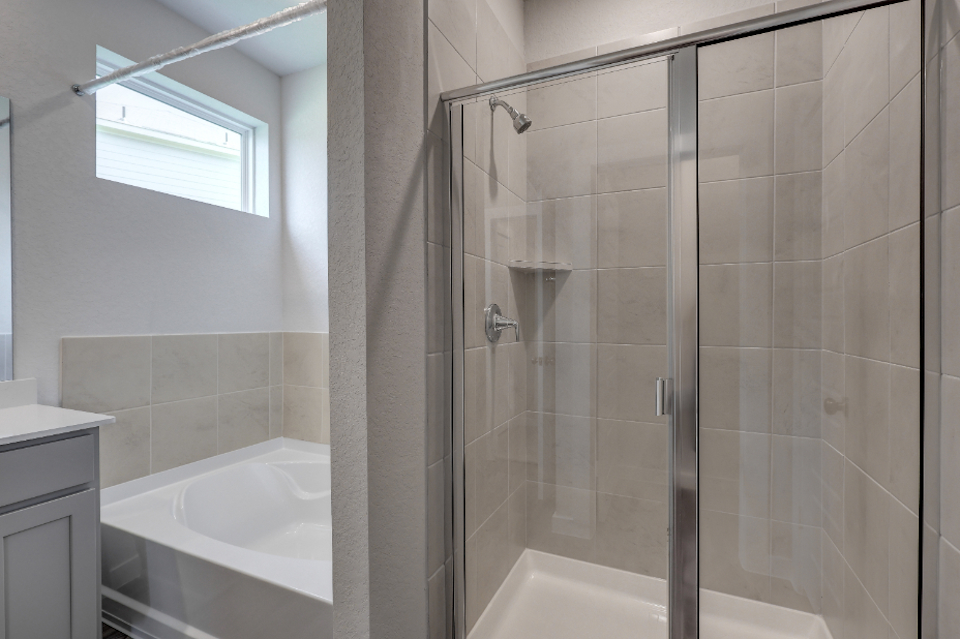 A bathroom with a glass shower.