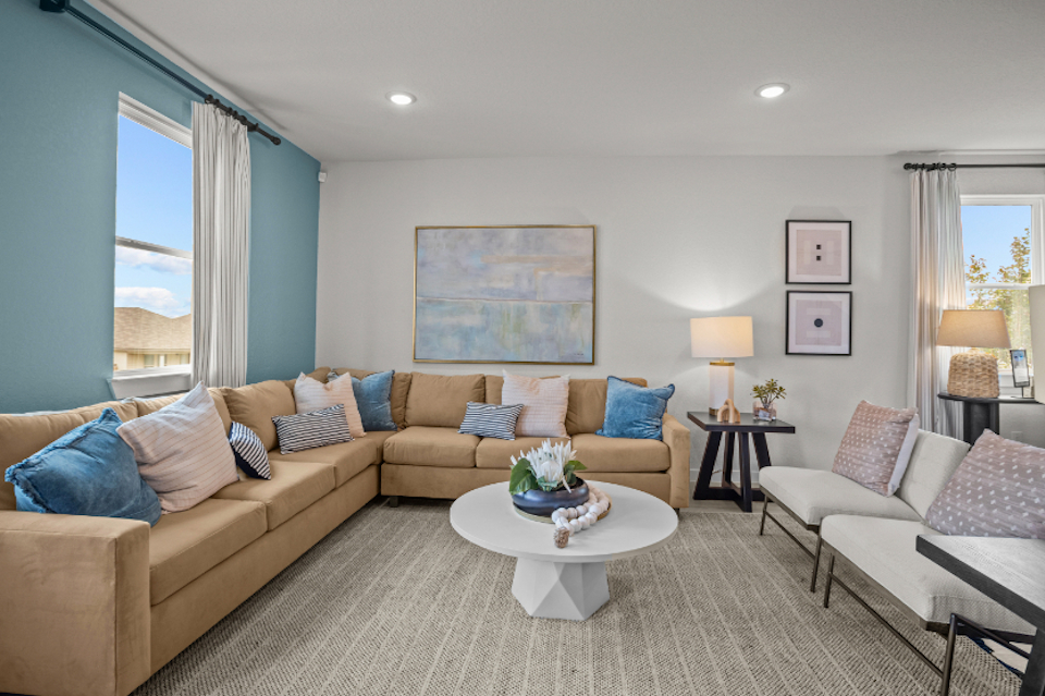 A living room with a couch and a coffee table.