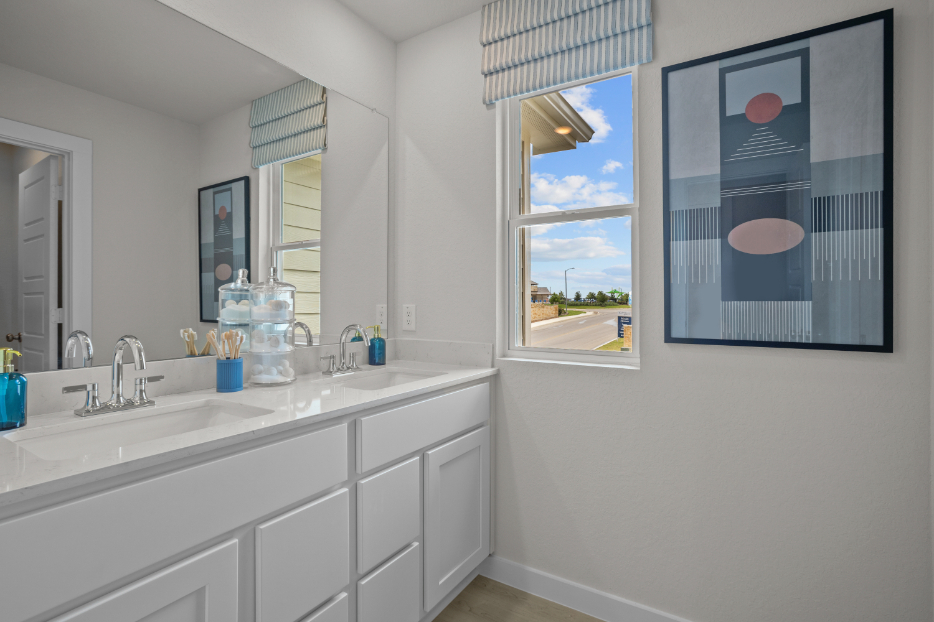 A bathroom with a sink and a mirror.