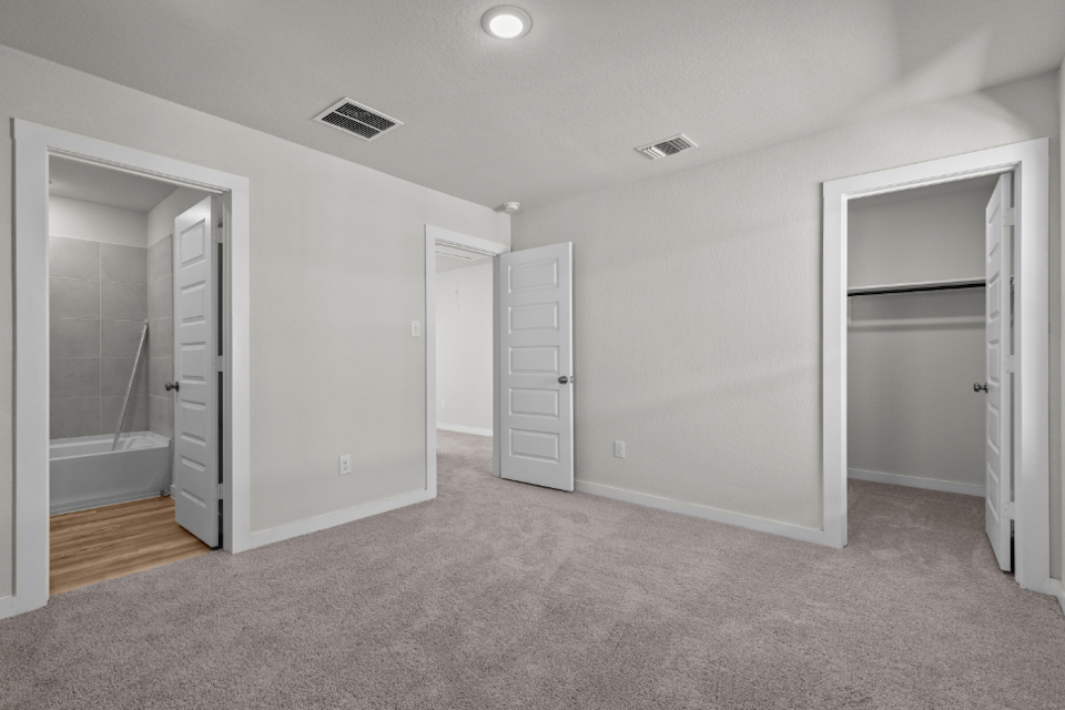 A room with white cabinets.