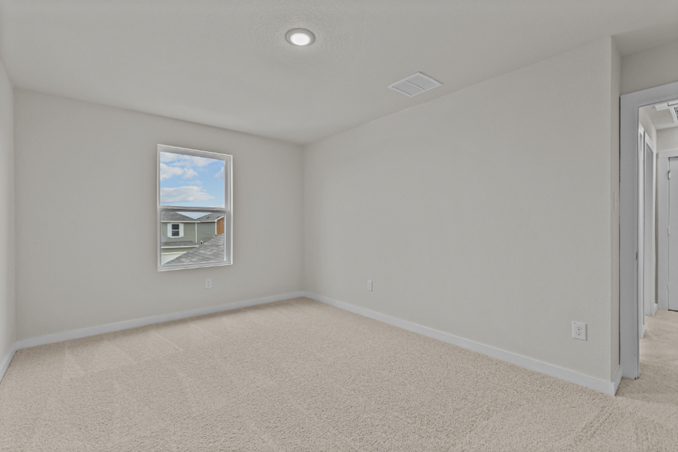 A room with a painting on the wall.