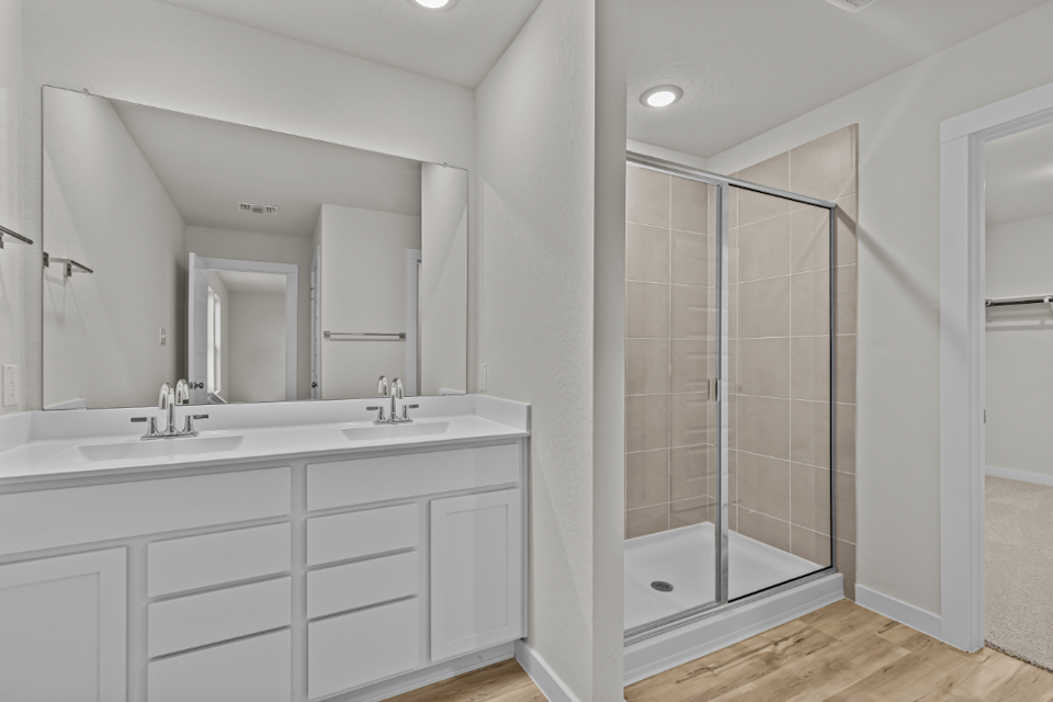 A bathroom with a glass shower.