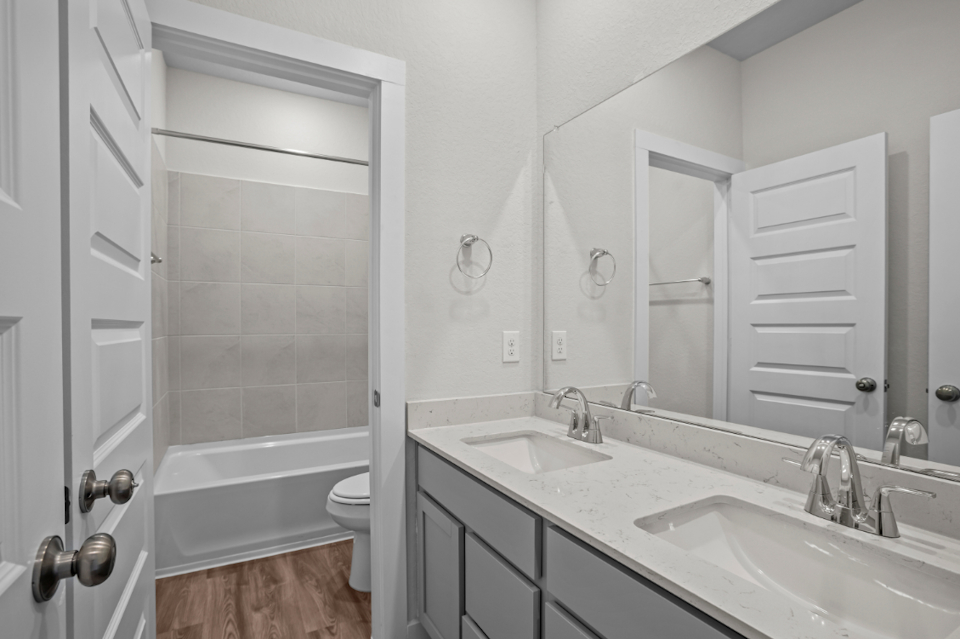 A bathroom with a sink and a bathtub.