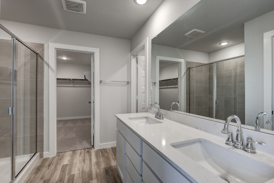 A bathroom with a glass shower.