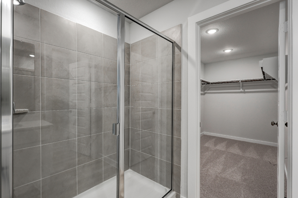 A shower with glass doors.