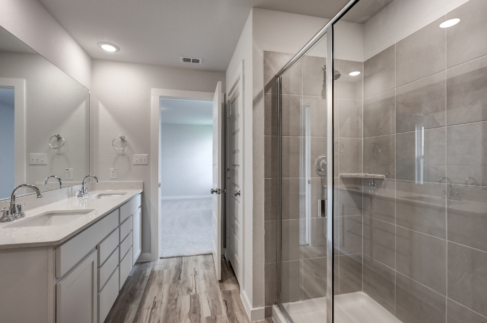 A bathroom with a glass shower.
