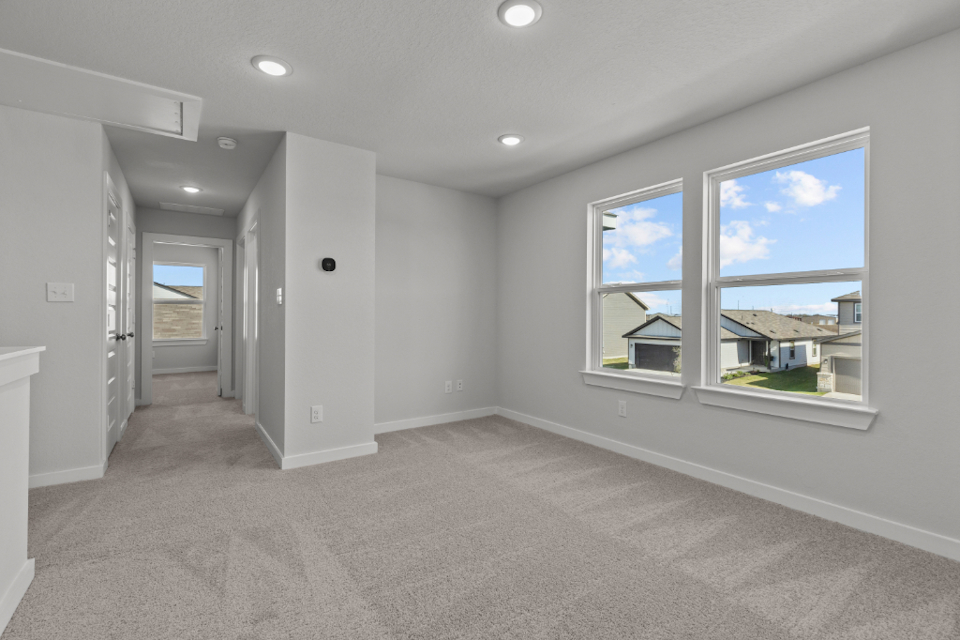 A room with a window and a door.